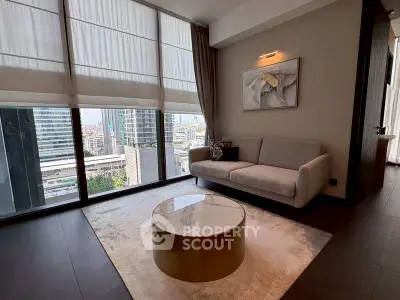 Modern living room with large windows and city view, featuring stylish furniture and decor.