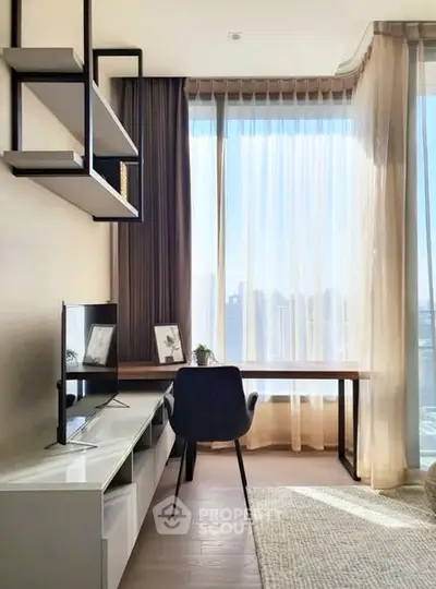 Bright study room with large window and modern furniture, perfect for productivity and relaxation.