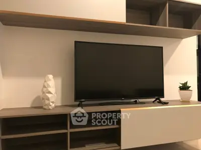 Modern living room with sleek TV unit and stylish decor