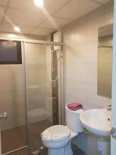 Modern bathroom with shower enclosure and sleek fixtures