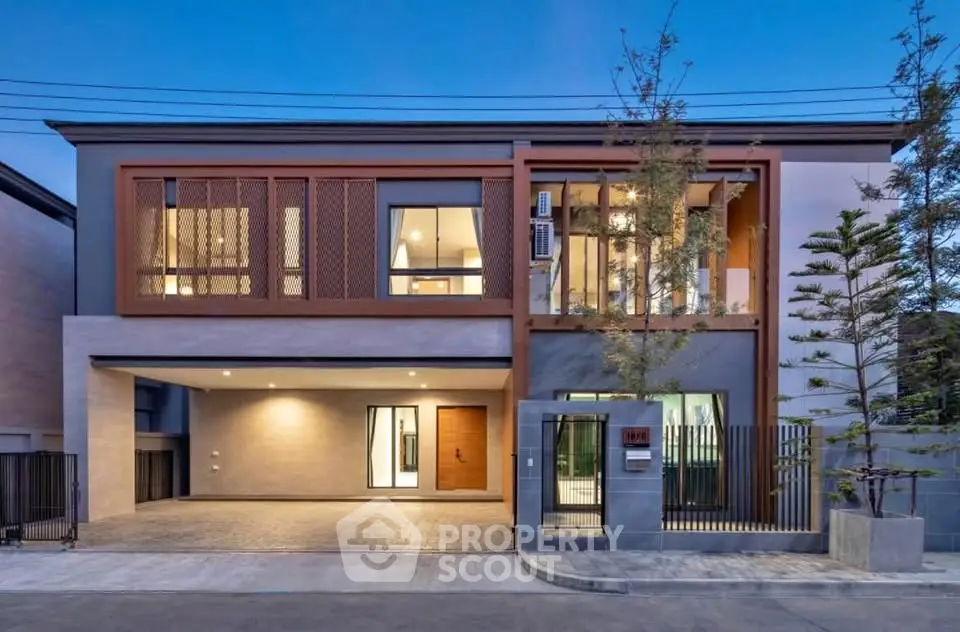 Modern two-story house with spacious garage and elegant facade