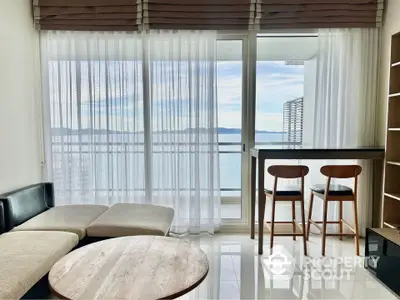 Modern living room with stunning ocean view and stylish furniture