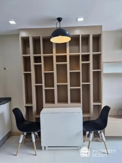 Modern study area with stylish shelving and seating in contemporary home