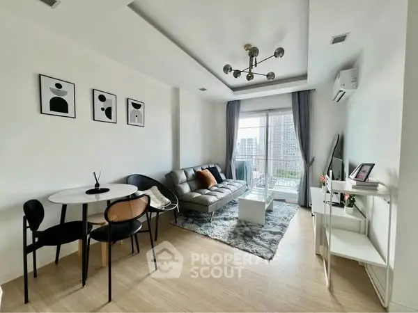 Modern living room with stylish decor and city view, featuring a cozy seating area and dining space.