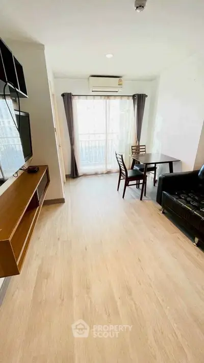 Modern living room with sleek furniture and natural light, perfect for urban living.