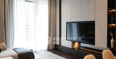 Luxurious modern living room with large TV and elegant decor
