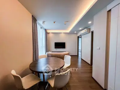 Modern living room with dining area and stylish lighting