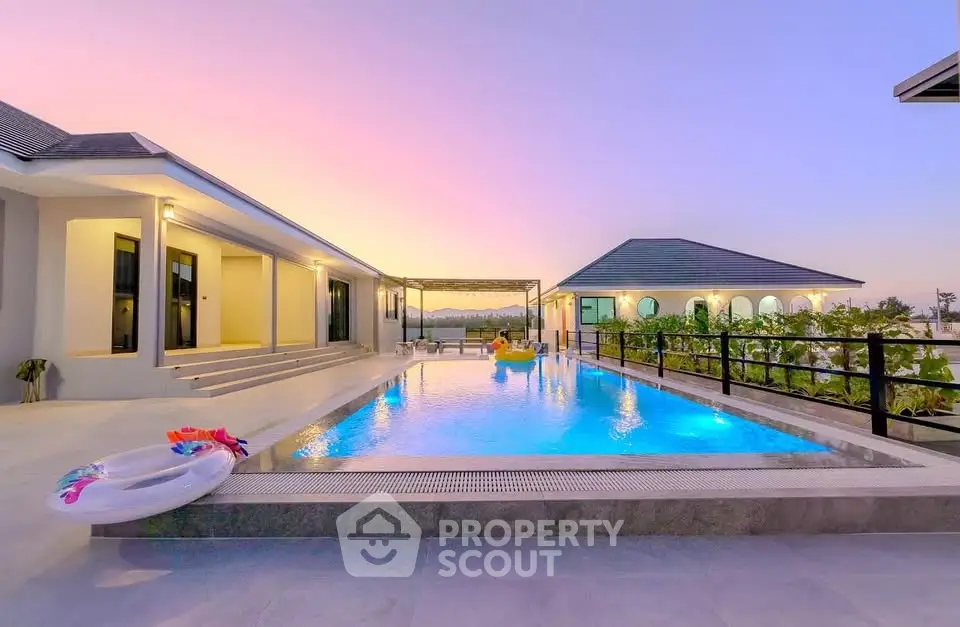 Luxurious modern villa with stunning pool and sunset view