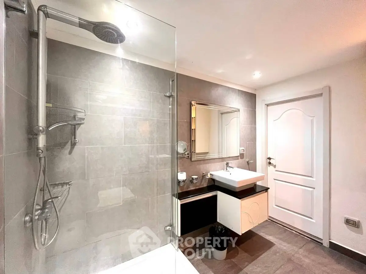 Modern bathroom with sleek design and glass shower enclosure