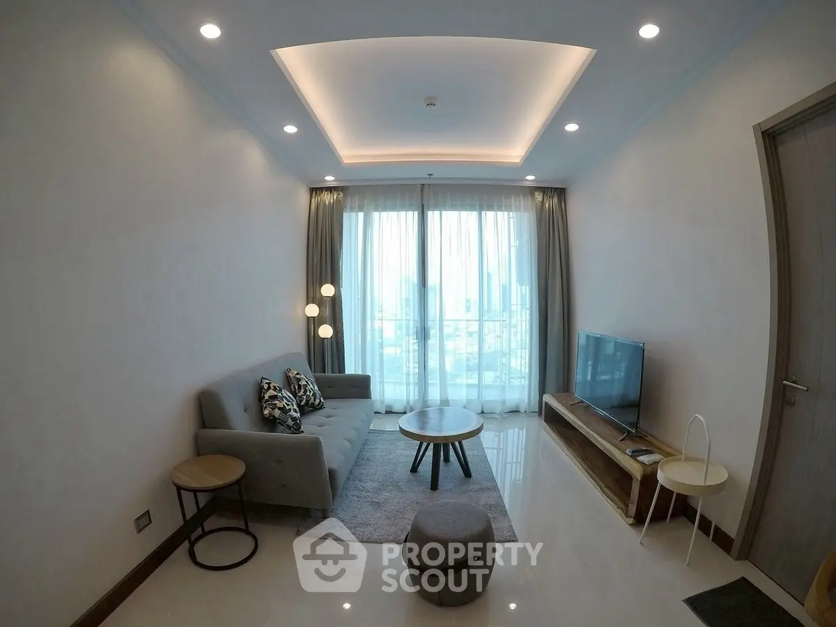 Modern living room with stylish furniture and city view through large windows.