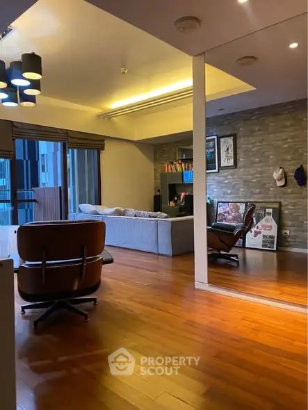 Stylish living room with modern furniture and large windows for natural light.