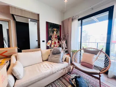 Chic living room with modern decor and city view balcony, perfect for urban living.