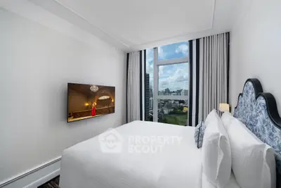 Luxurious bedroom with city view and elegant decor