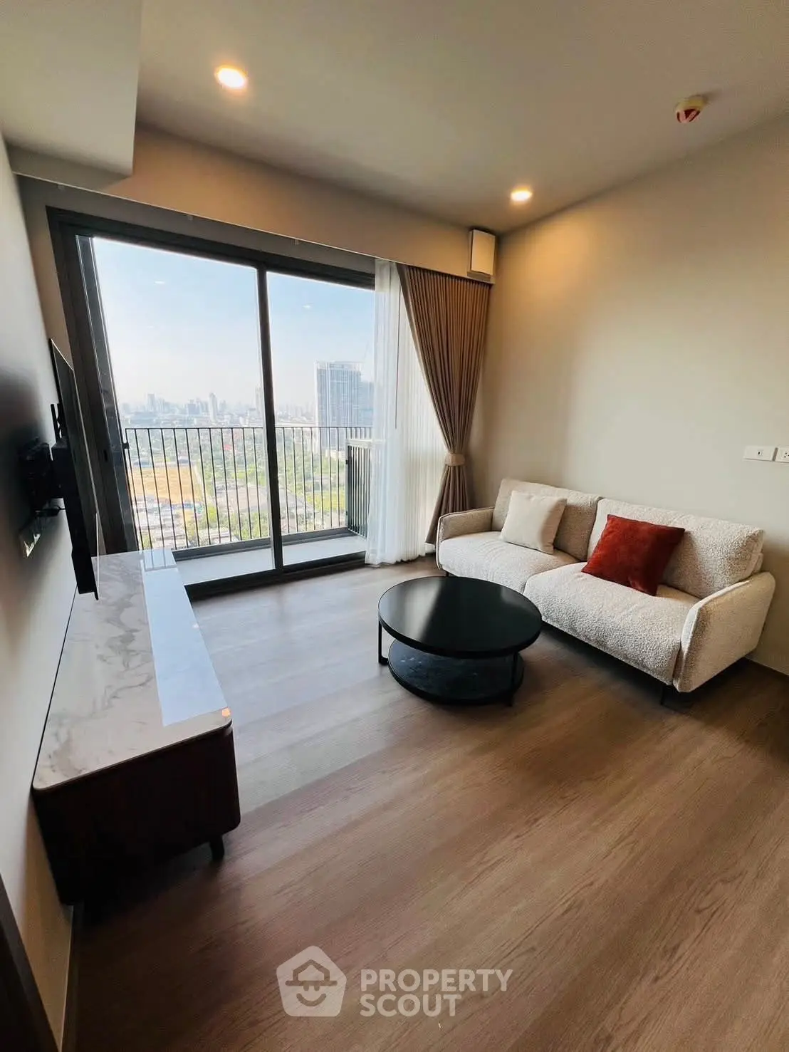 Modern living room with city view and stylish furniture