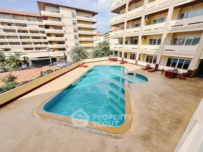 Spacious apartment complex with inviting outdoor pool and sun loungers