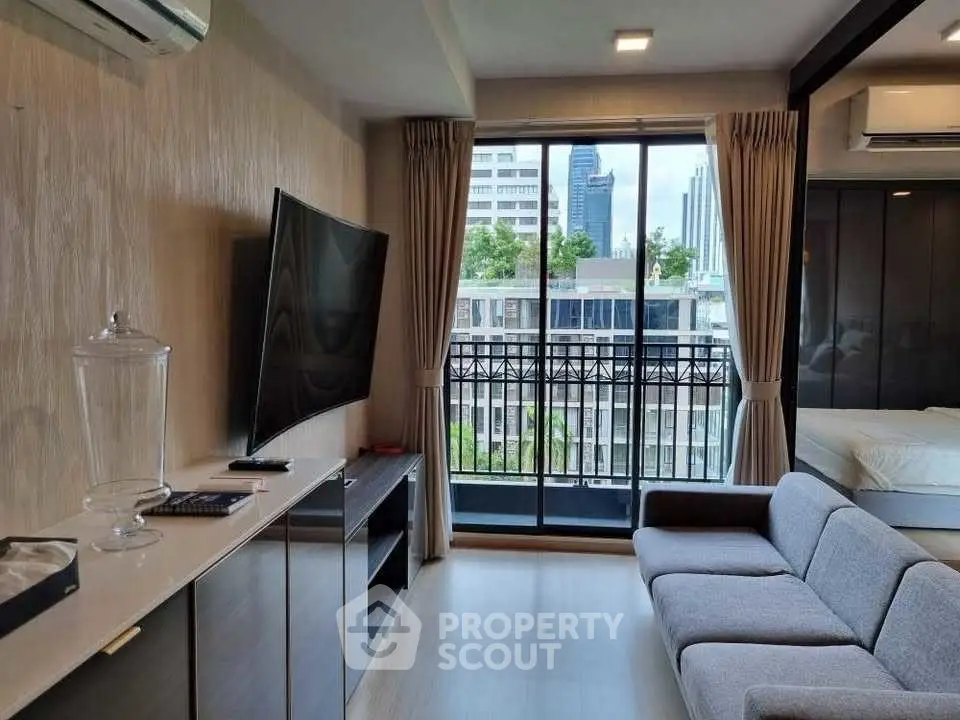 Modern living room with balcony view in urban apartment