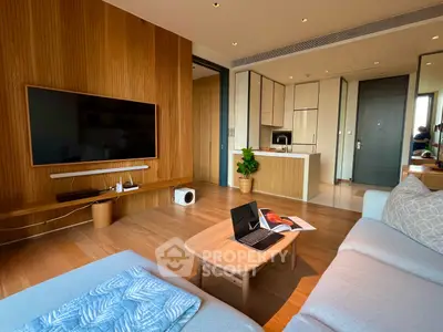 Modern living room with wooden accents and open kitchen layout