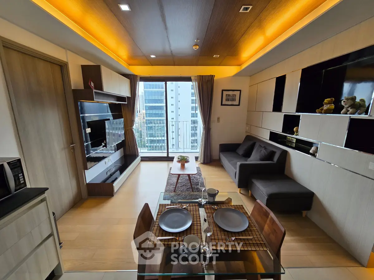 Modern living room with city view, stylish decor, and cozy dining area in a high-rise apartment.