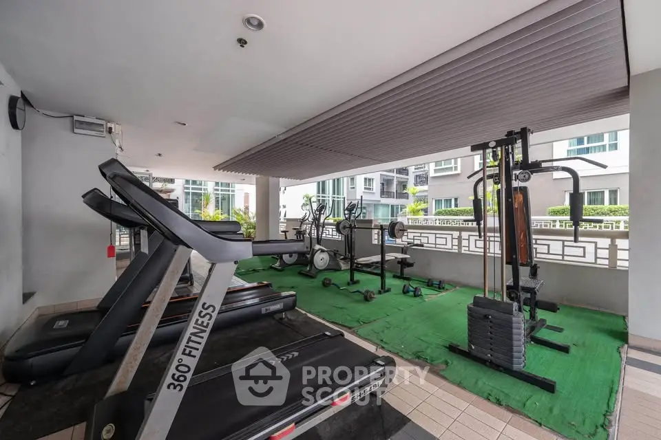 Modern gym with fitness equipment in a residential building
