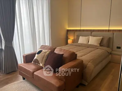 Luxurious bedroom with elegant decor and cozy seating area