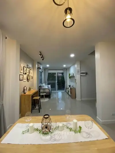 Spacious modern living room with elegant decor and ambient lighting, perfect for relaxation and entertainment.