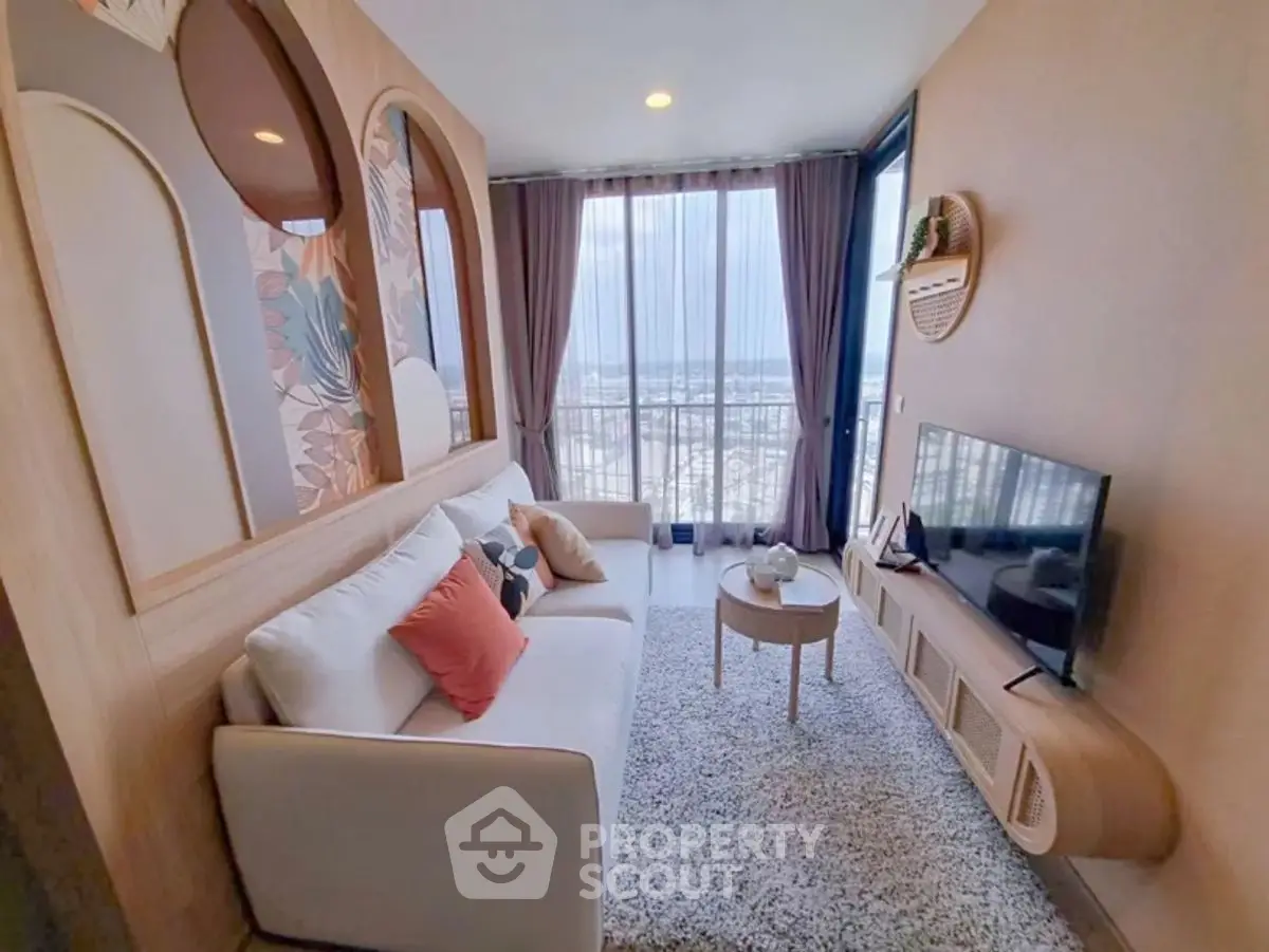 Stylish living room with modern decor and panoramic city view.
