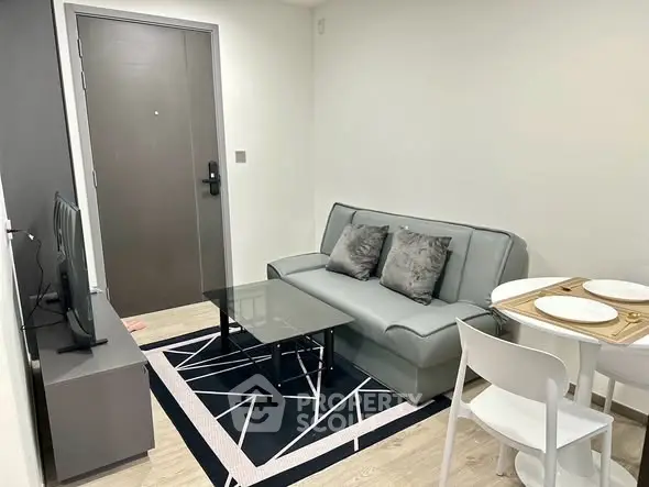 Modern living room with sleek furniture and stylish decor in a cozy apartment.