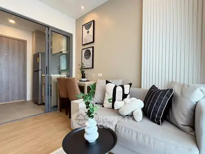 Modern living room with stylish decor and open kitchen layout