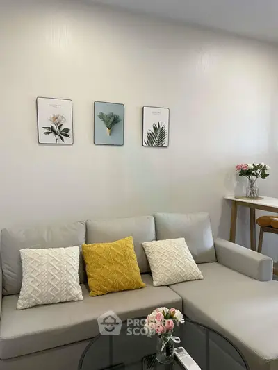 Stylish living room with modern decor and cozy seating area, perfect for relaxation and entertaining.