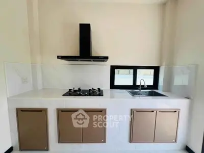 Modern kitchen with sleek gas stove and stylish cabinetry