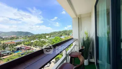 Stunning balcony view with lush greenery and mountains, perfect for relaxation.