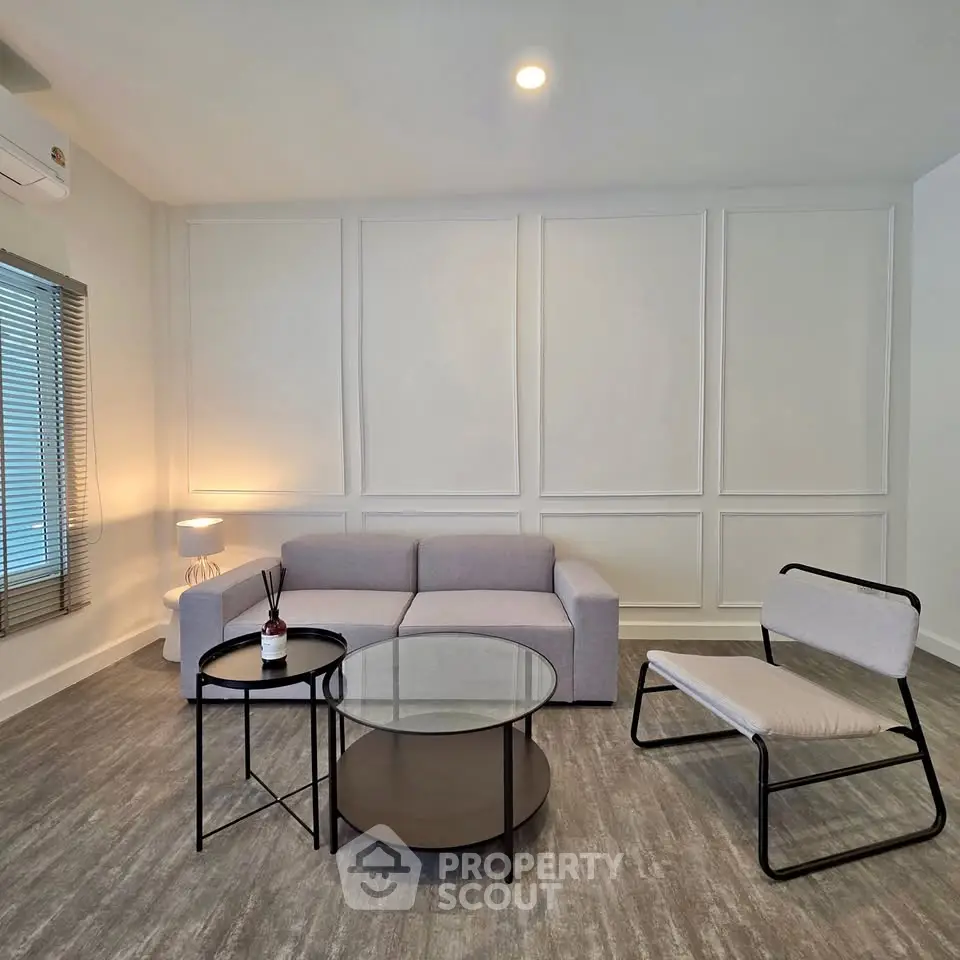 Modern minimalist living room with stylish furniture and soft lighting