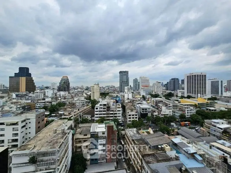 Stunning cityscape view showcasing urban skyline under dramatic cloudy skies.