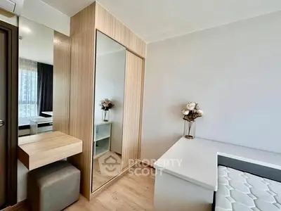 Modern bedroom with stylish wooden wardrobe and elegant decor