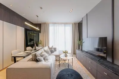 Luxurious modern living room with elegant decor and large window, perfect for relaxation and entertainment.