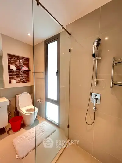 Modern bathroom with glass shower and sleek fixtures