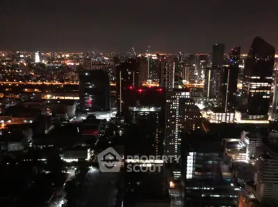 Stunning city skyline view at night with illuminated skyscrapers.