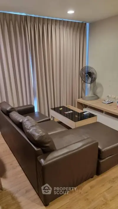 Cozy living room with leather sofa and modern decor