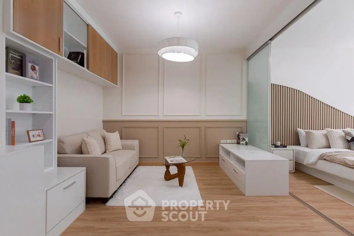 Modern living room with cozy sofa and elegant decor in open layout