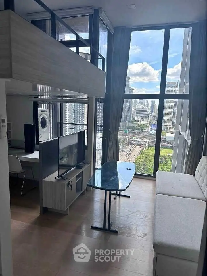 Modern high-rise condo with floor-to-ceiling windows and stunning city view