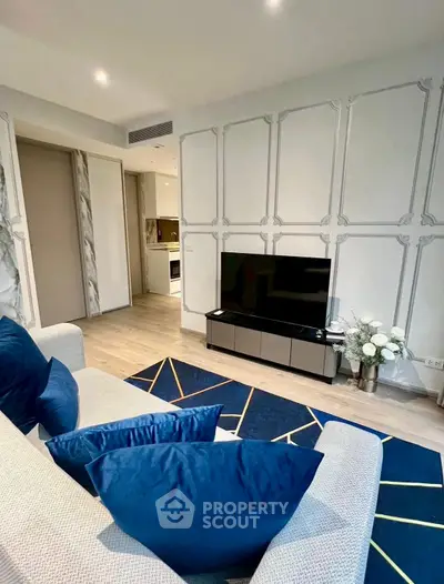 Modern living room with stylish decor and open kitchen layout