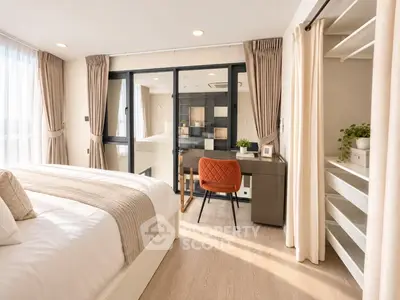 Luxurious bedroom with study area, featuring elegant decor and ample natural light.