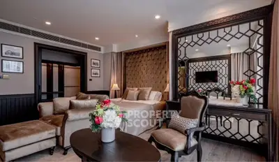 Luxurious living room with elegant decor and plush seating in a modern apartment.