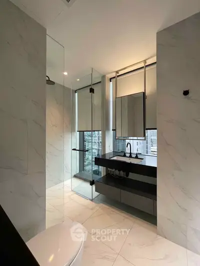 Luxurious modern bathroom with sleek design and city view, featuring elegant fixtures and marble finishes.