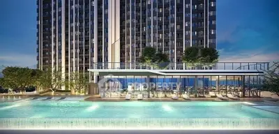 Luxurious high-rise building with stunning pool and modern amenities, perfect for urban living.
