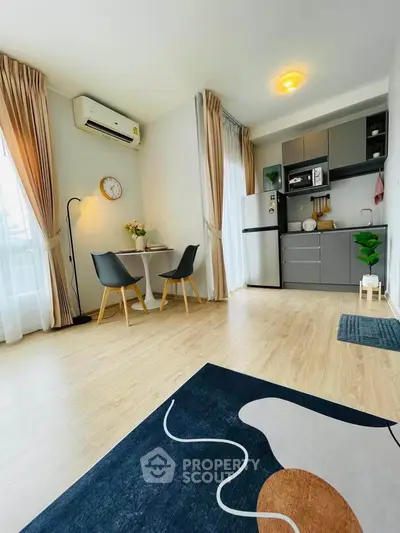 Modern open-plan living room with stylish kitchen and dining area