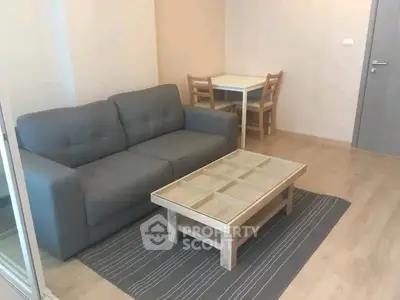 Cozy living room with modern sofa and stylish coffee table in a bright apartment.