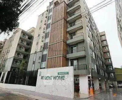 Modern apartment building exterior with balconies and contemporary design.