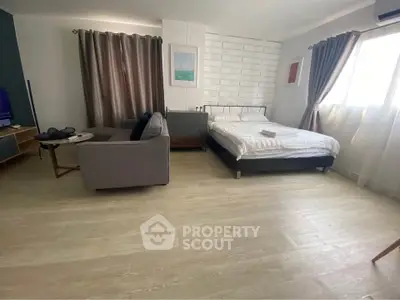 Spacious studio apartment with modern decor and natural light