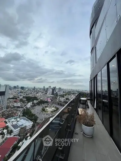 Stunning high-rise balcony with panoramic city views, perfect for urban living enthusiasts.
